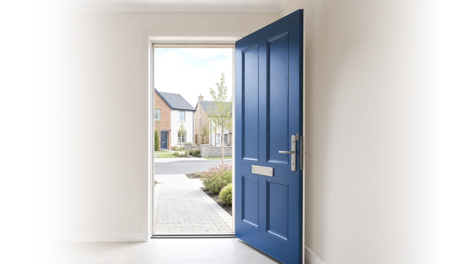 Open blue front door of a new build home